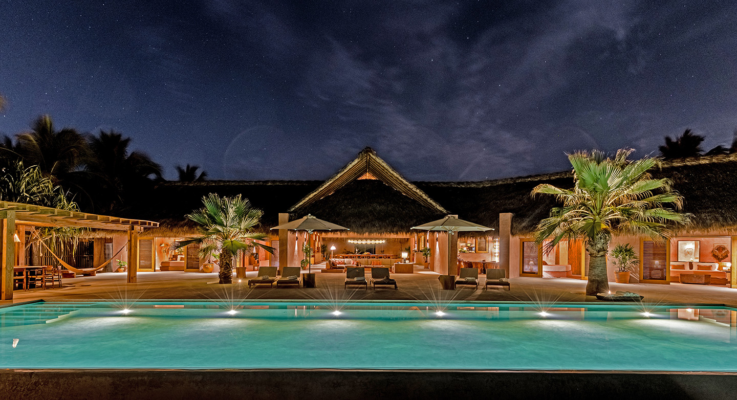 casa coco facade at night