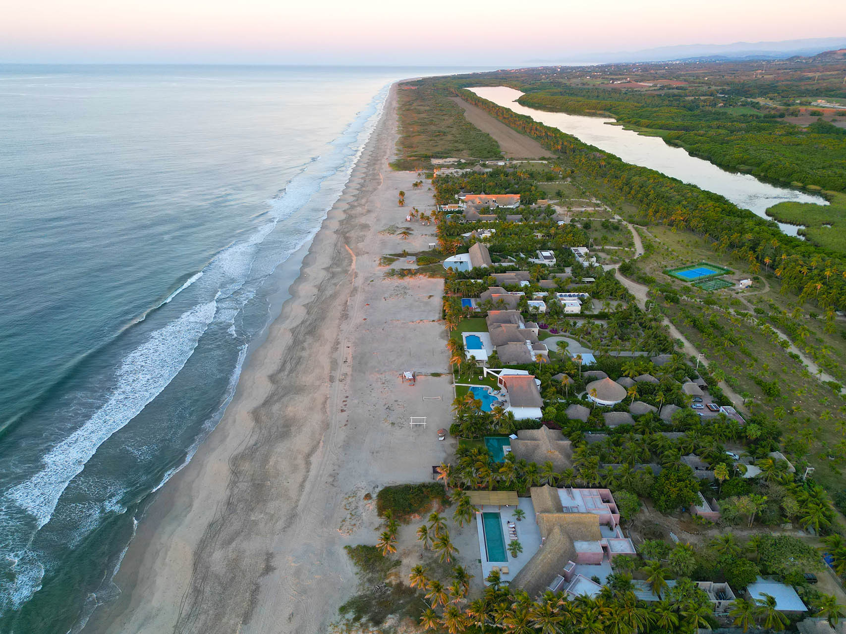 drone view of los naranjos beach and casa coco